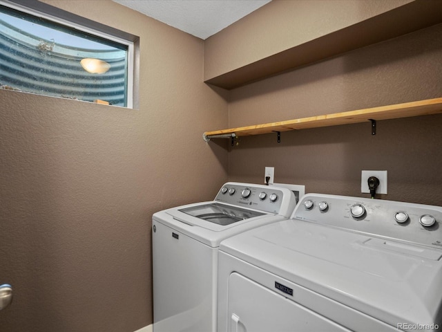 6943 Oak Way, Arvada, CO 80004 - laundry room featuring washing machine and dryer and a textured wall