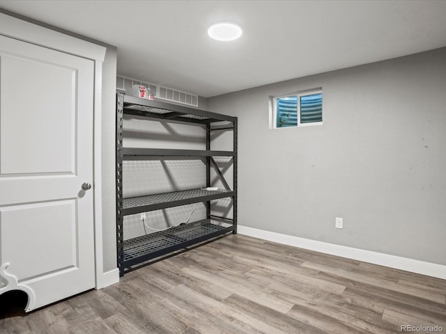 6943 Oak Way, Arvada, CO 80004 - unfurnished bedroom featuring wood finished floors