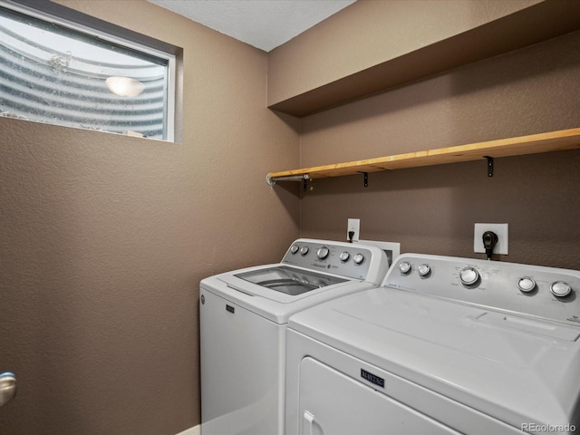 6943 Oak Way, Arvada, CO 80004 - washroom with independent washer and dryer and a textured wall