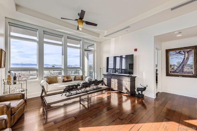 living room featuring hardwood / wood-style flooring and ceiling fan