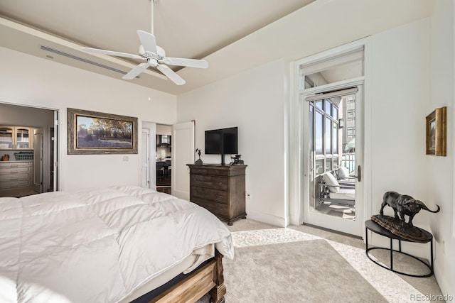 carpeted bedroom featuring ceiling fan and access to exterior