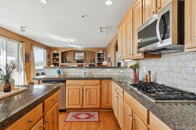 1022 Orion Way, Castle Rock, CO 80108 - kitchen with stainless steel appliances, tile counters, a sink, tasteful backsplash, and recessed lighting