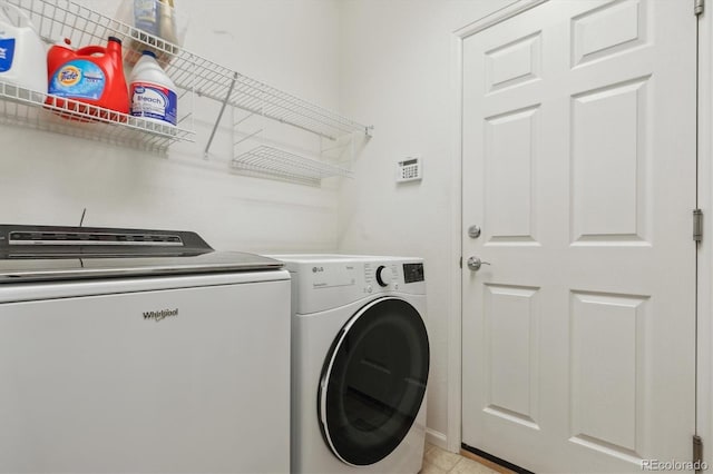 1022 Orion Way, Castle Rock, CO 80108 - laundry area featuring washing machine and dryer and light tile patterned floors