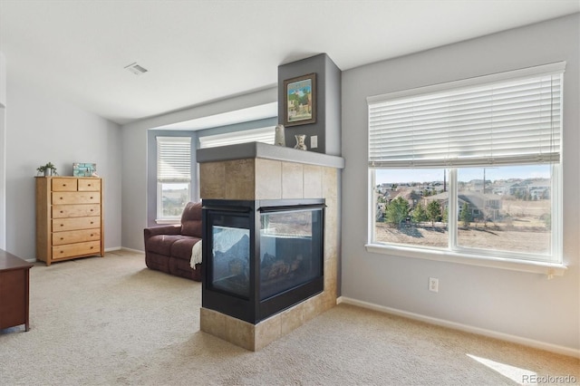 1022 Orion Way, Castle Rock, CO 80108 - carpeted living area with a fireplace, baseboards, and vaulted ceiling