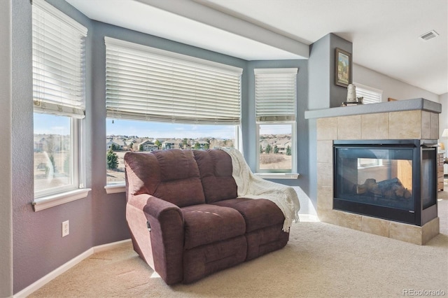 1022 Orion Way, Castle Rock, CO 80108 - living area featuring carpet floors, baseboards, a tile fireplace, and a textured wall