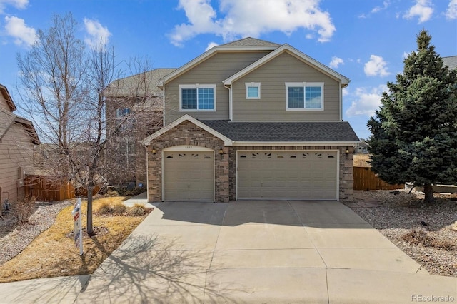 1022 Orion Way, Castle Rock, CO 80108 - view of front facade featuring a garage, concrete driveway, brick siding, and roof with shingles