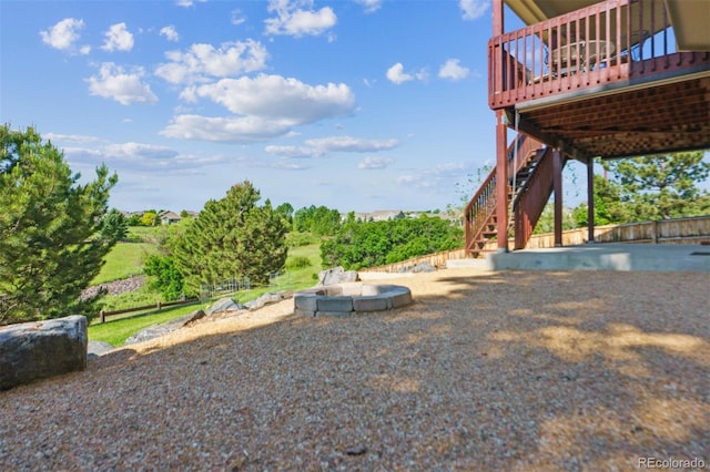 1022 Orion Way, Castle Rock, CO 80108 - view of yard featuring stairway, an outdoor fire pit, and a deck
