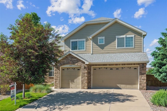 1022 Orion Way, Castle Rock, CO 80108 - view of front facade featuring concrete driveway, roof with shingles, and an attached garage