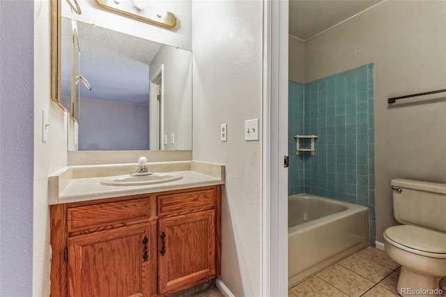 bathroom with bathing tub / shower combination, toilet, a textured ceiling, vanity, and tile patterned floors