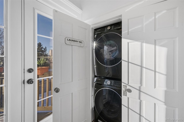 washroom with laundry area and stacked washing maching and dryer