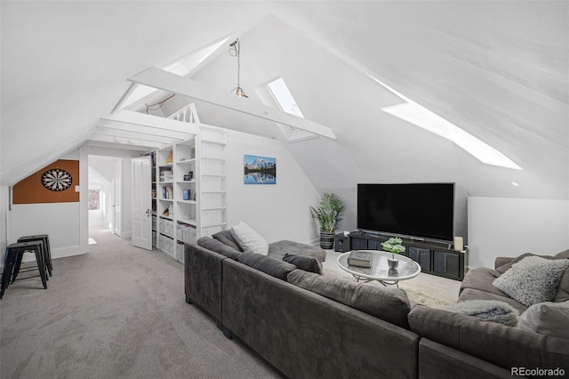 carpeted living area with lofted ceiling with skylight