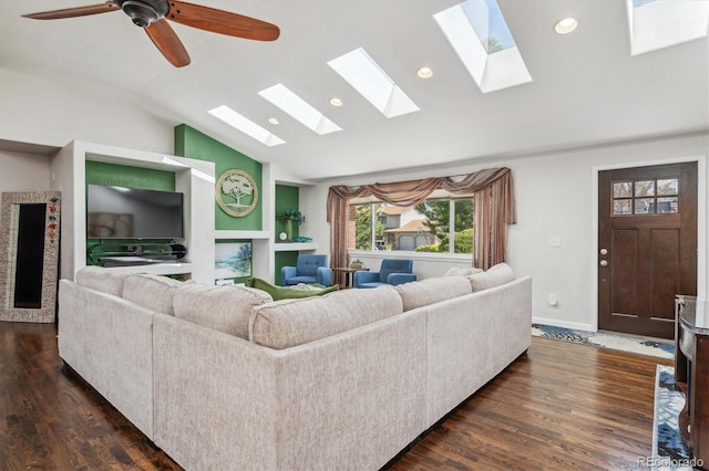 living room with ceiling fan, dark hardwood / wood-style floors, and vaulted ceiling