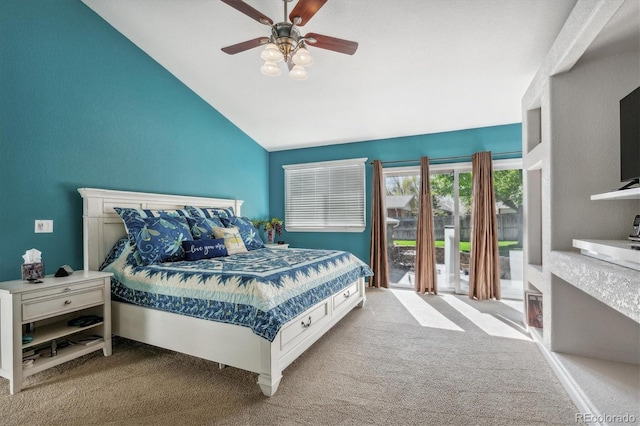 carpeted bedroom featuring ceiling fan, lofted ceiling, and access to exterior