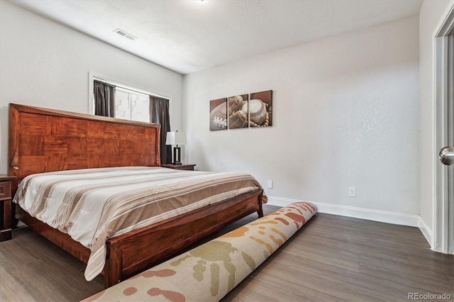 bedroom with wood-type flooring