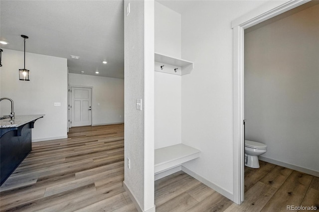 260 E 4th St, Berthoud, CO 80513 - mudroom with recessed lighting, wood finished floors, and baseboards