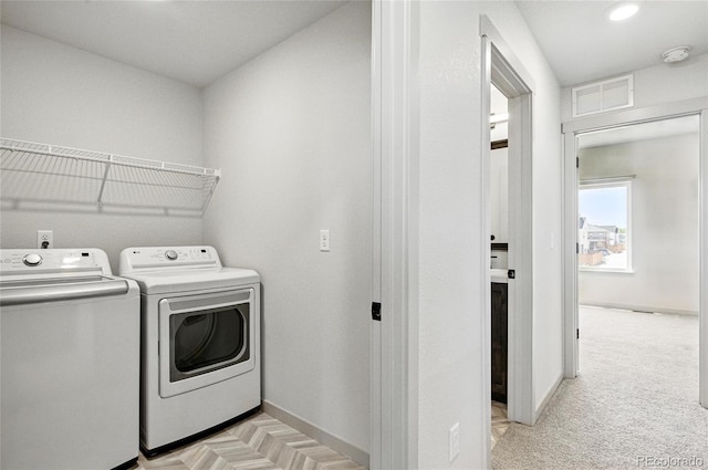 260 E 4th St, Berthoud, CO 80513 - laundry area with separate washer and dryer, baseboards, and recessed lighting