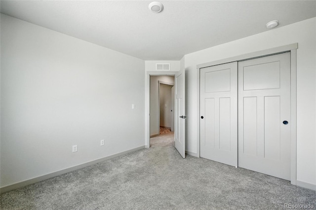 260 E 4th St, Berthoud, CO 80513 - unfurnished bedroom featuring light colored carpet, baseboards, and a closet