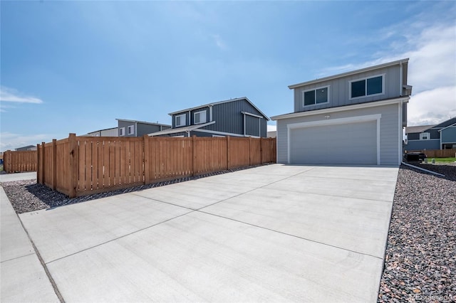 260 E 4th St, Berthoud, CO 80513 - view of front of house featuring fence, driveway, board and batten siding, and cooling unit
