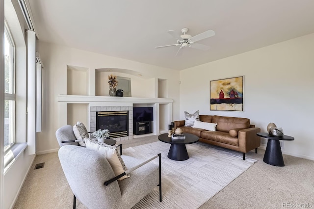 8915 S Field Ct, Littleton, CO 80128 - carpeted living room with ceiling fan, a tile fireplace, and baseboards