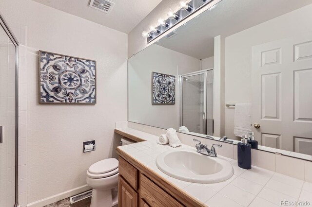 8915 S Field Ct, Littleton, CO 80128 - bathroom with vanity, a stall shower, and toilet