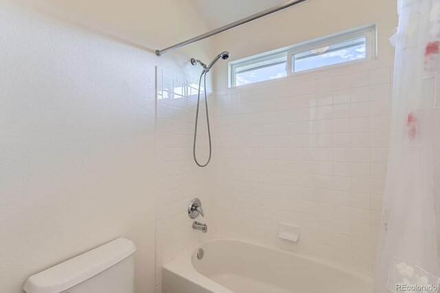 8915 S Field Ct, Littleton, CO 80128 - bathroom featuring toilet and shower / bath combo