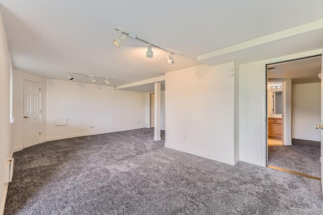 8915 S Field Ct, Littleton, CO 80128 - carpeted empty room with rail lighting and baseboards