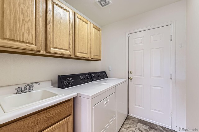 8915 S Field Ct, Littleton, CO 80128 - laundry area featuring separate washer and dryer and cabinet space