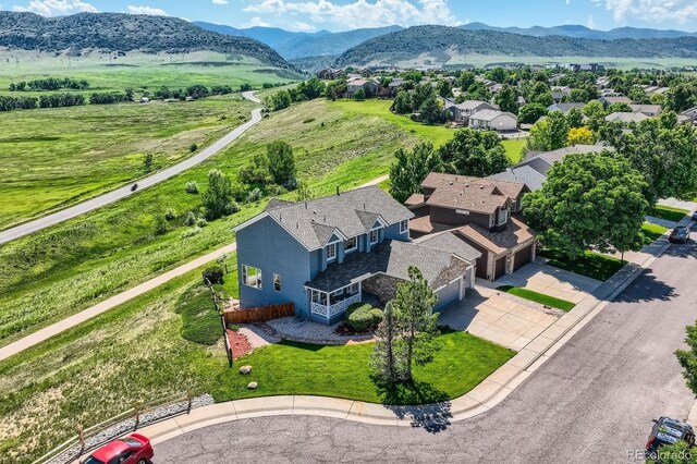 8915 S Field Ct, Littleton, CO 80128 - aerial view of property and surrounding area featuring a mountainous background