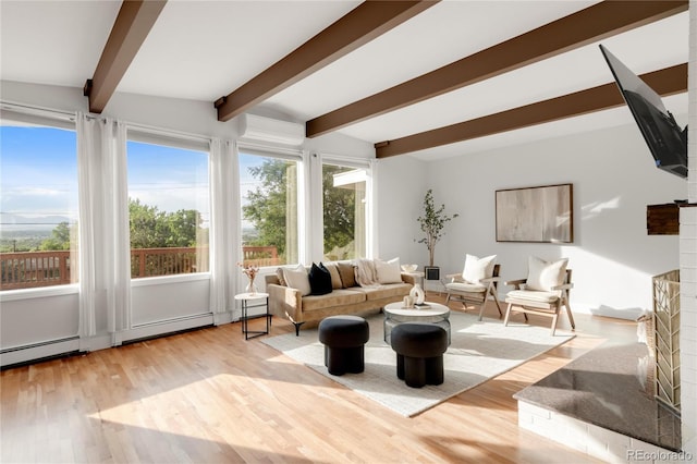41 Skyline Dr, Wheat Ridge, CO 80215 - living room featuring plenty of natural light, beamed ceiling, wood finished floors, baseboard heating, and a brick fireplace