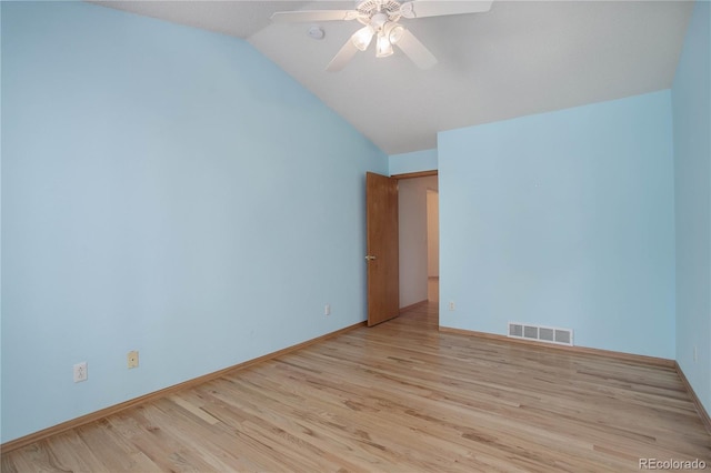 unfurnished room featuring ceiling fan, light hardwood / wood-style flooring, and vaulted ceiling