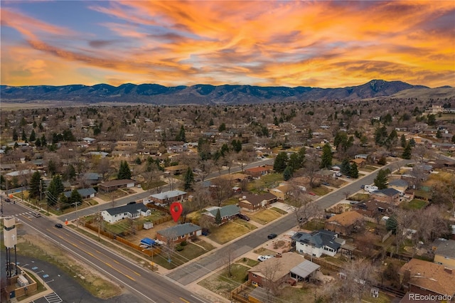 aerial view at dusk with a residential view and a mountain view