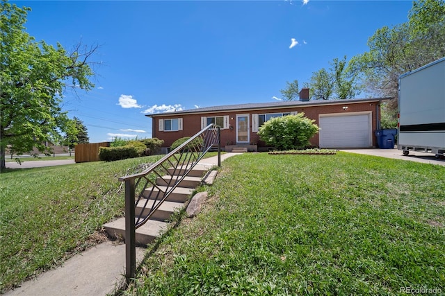 12024 W Maryland Dr, Lakewood, CO 80228 - ranch-style home with an attached garage, brick siding, a front lawn, and driveway