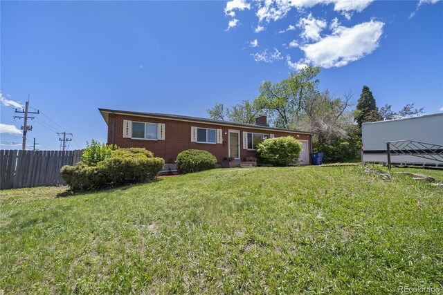 12024 W Maryland Dr, Lakewood, CO 80228 - view of front facade with brick siding and a chimney