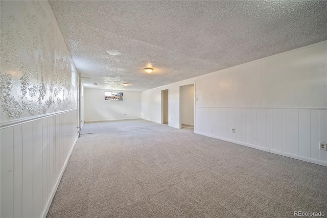 12024 W Maryland Dr, Lakewood, CO 80228 - carpeted spare room featuring a textured ceiling and a wainscoted wall