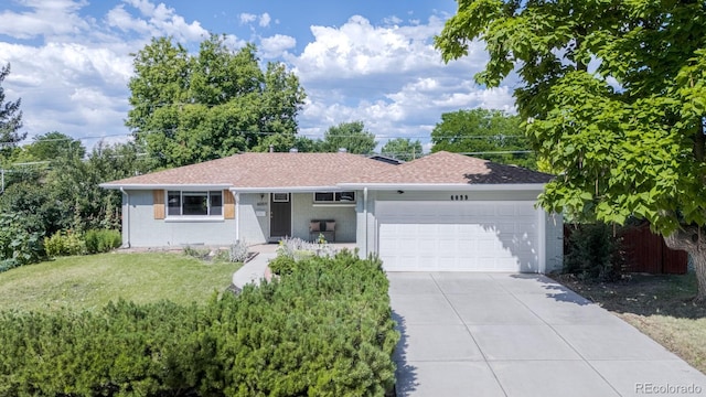 6059 Routt St, Arvada, CO 80004 - ranch-style home featuring an attached garage, a front yard, concrete driveway, and brick siding