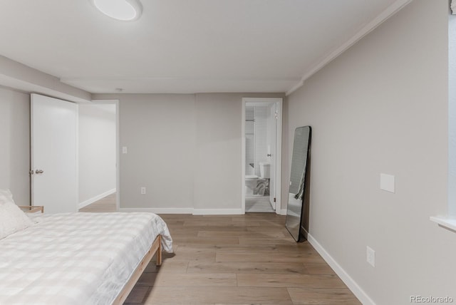6059 Routt St, Arvada, CO 80004 - bedroom featuring light wood-style flooring and ensuite bathroom