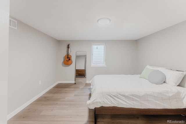 6059 Routt St, Arvada, CO 80004 - bedroom with light wood finished floors and baseboards
