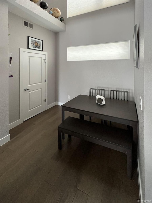 dining area featuring dark hardwood / wood-style floors