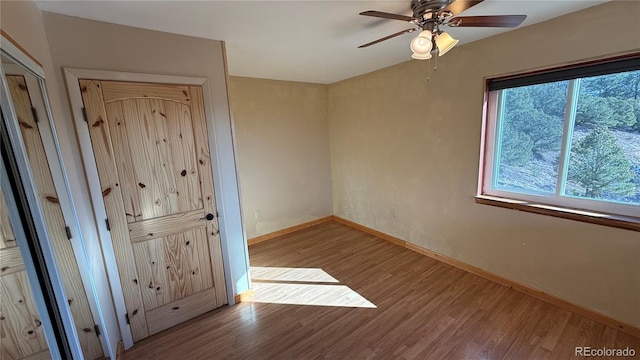 empty room featuring light hardwood / wood-style flooring and ceiling fan