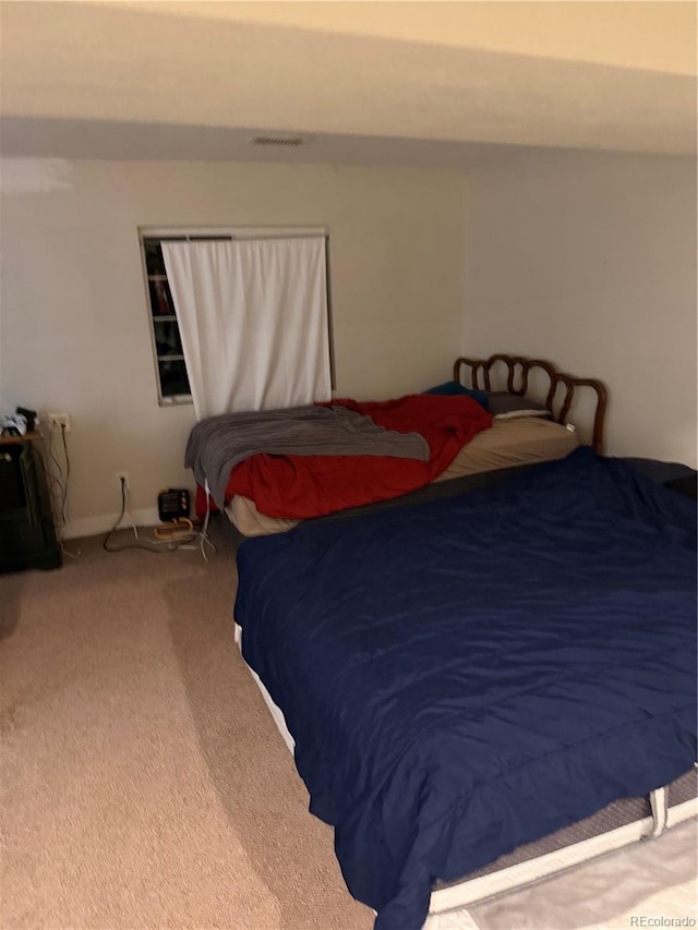 carpeted bedroom with visible vents