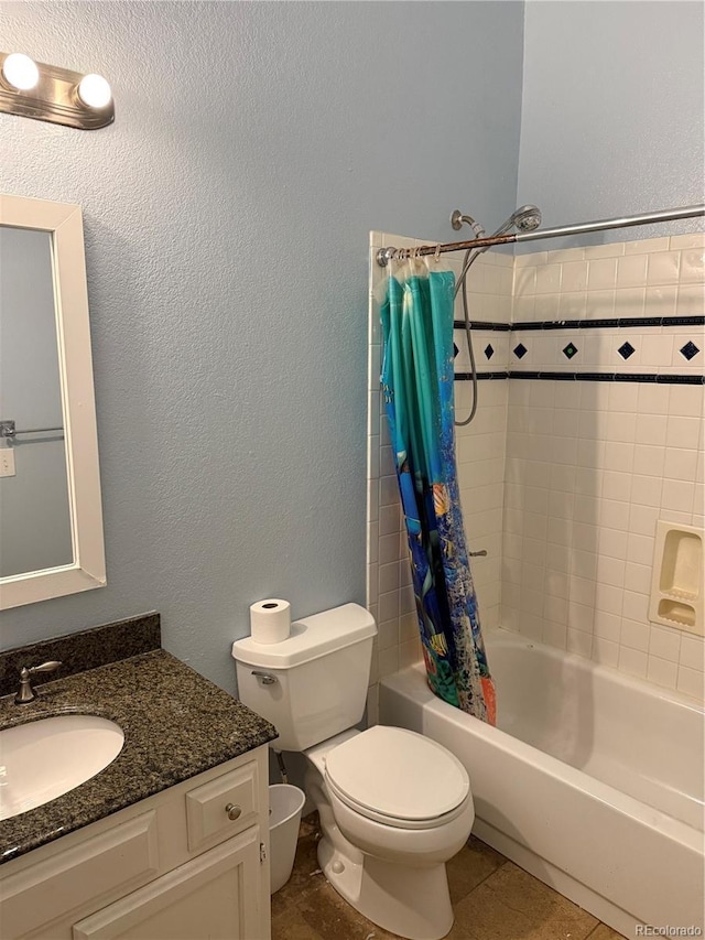 full bath featuring a textured wall, toilet, tile patterned floors, shower / bathtub combination with curtain, and vanity