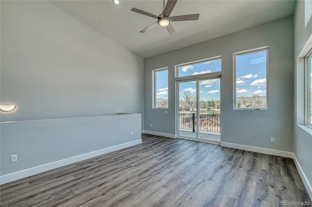 empty room with light wood-type flooring, vaulted ceiling, and ceiling fan