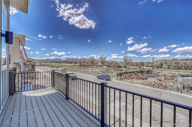 wooden terrace featuring a mountain view