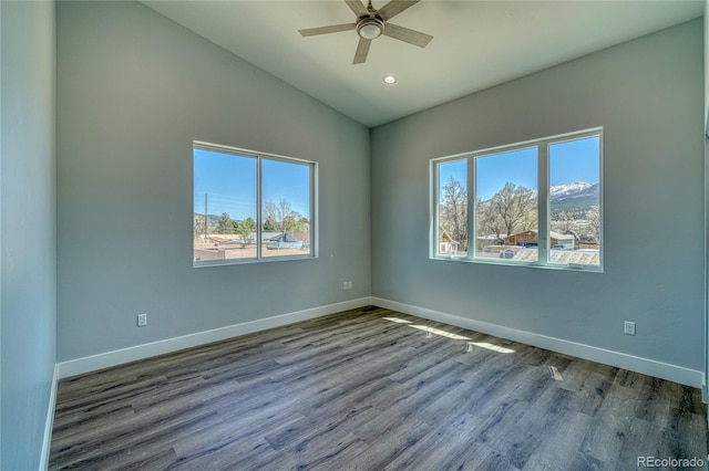 unfurnished room featuring ceiling fan, a healthy amount of sunlight, wood-type flooring, and lofted ceiling