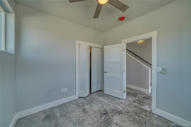 unfurnished bedroom featuring ceiling fan and light carpet