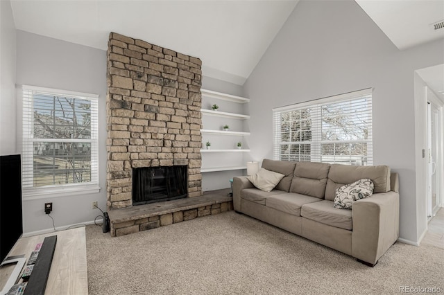 living area featuring baseboards, visible vents, built in shelves, high vaulted ceiling, and a fireplace