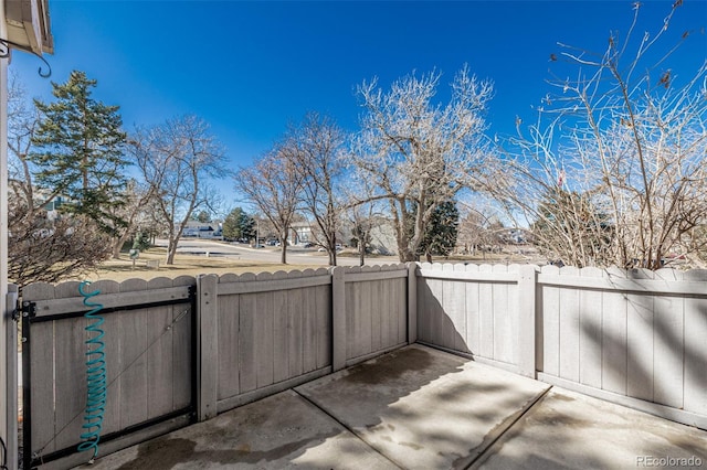 view of patio / terrace with fence and a gate