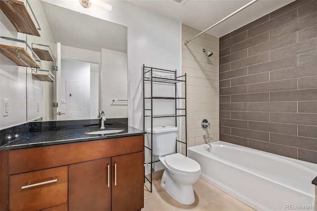 bathroom with tile patterned flooring, toilet, vanity, and shower / bath combination