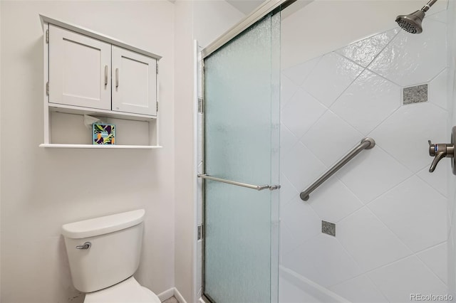 full bathroom with toilet and a stall shower