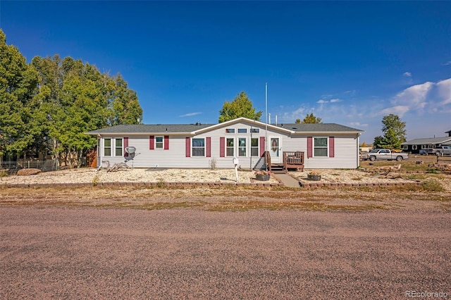 view of front of property with a wooden deck